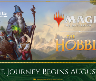 Official promotional key art for Magic: The Gathering’s The Hobbit set, featuring Bilbo Baggins holding a glowing sword alongside Gandalf the Grey with a sprawling Middle-earth landscape in the background.
